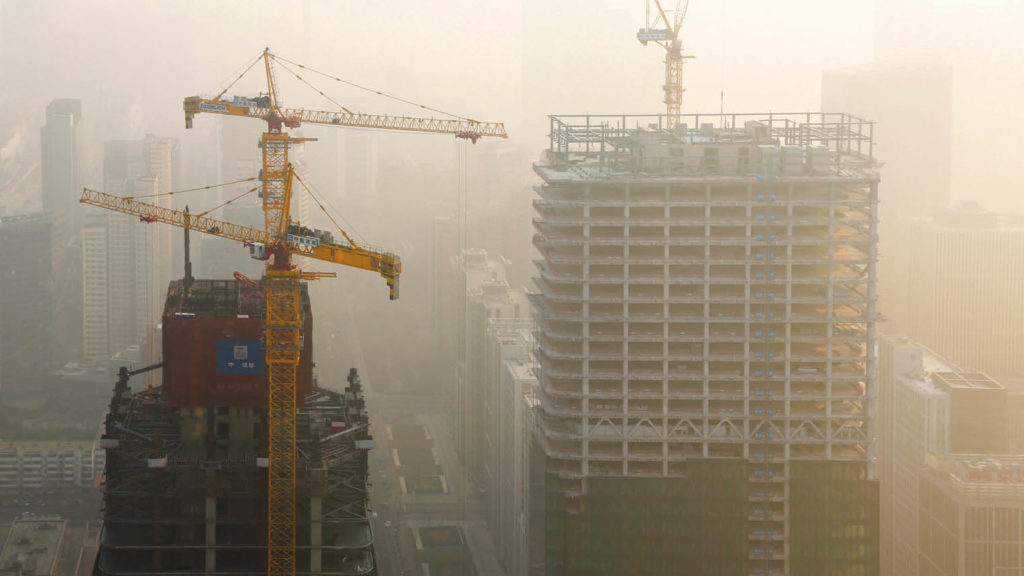 Heavy smog shrouding construction sites in Beijing